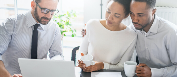 Couple reviews their finances with an advisor
