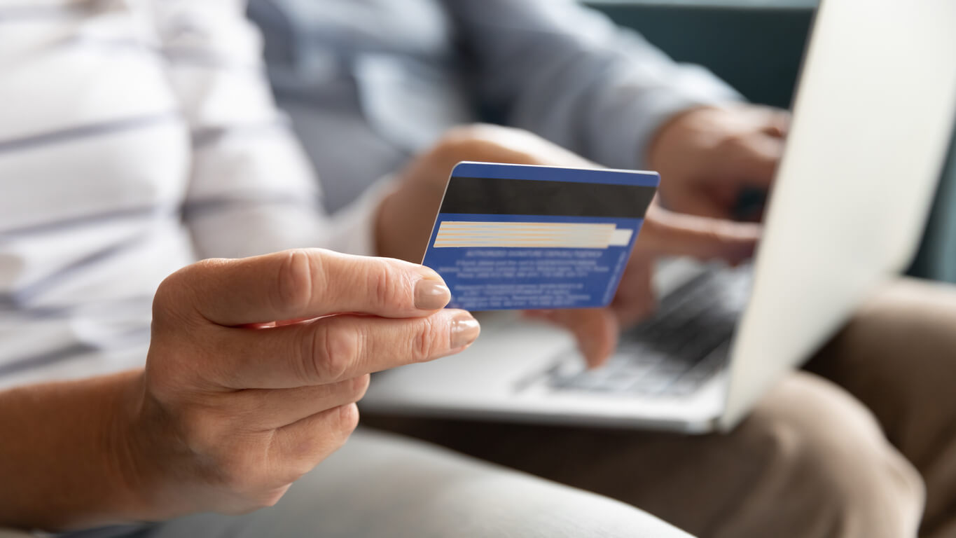 woman holding a credit card