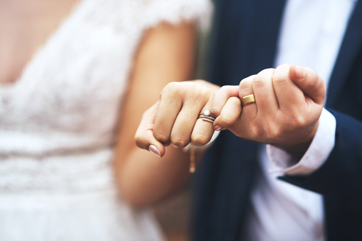 married couple's hands with rings