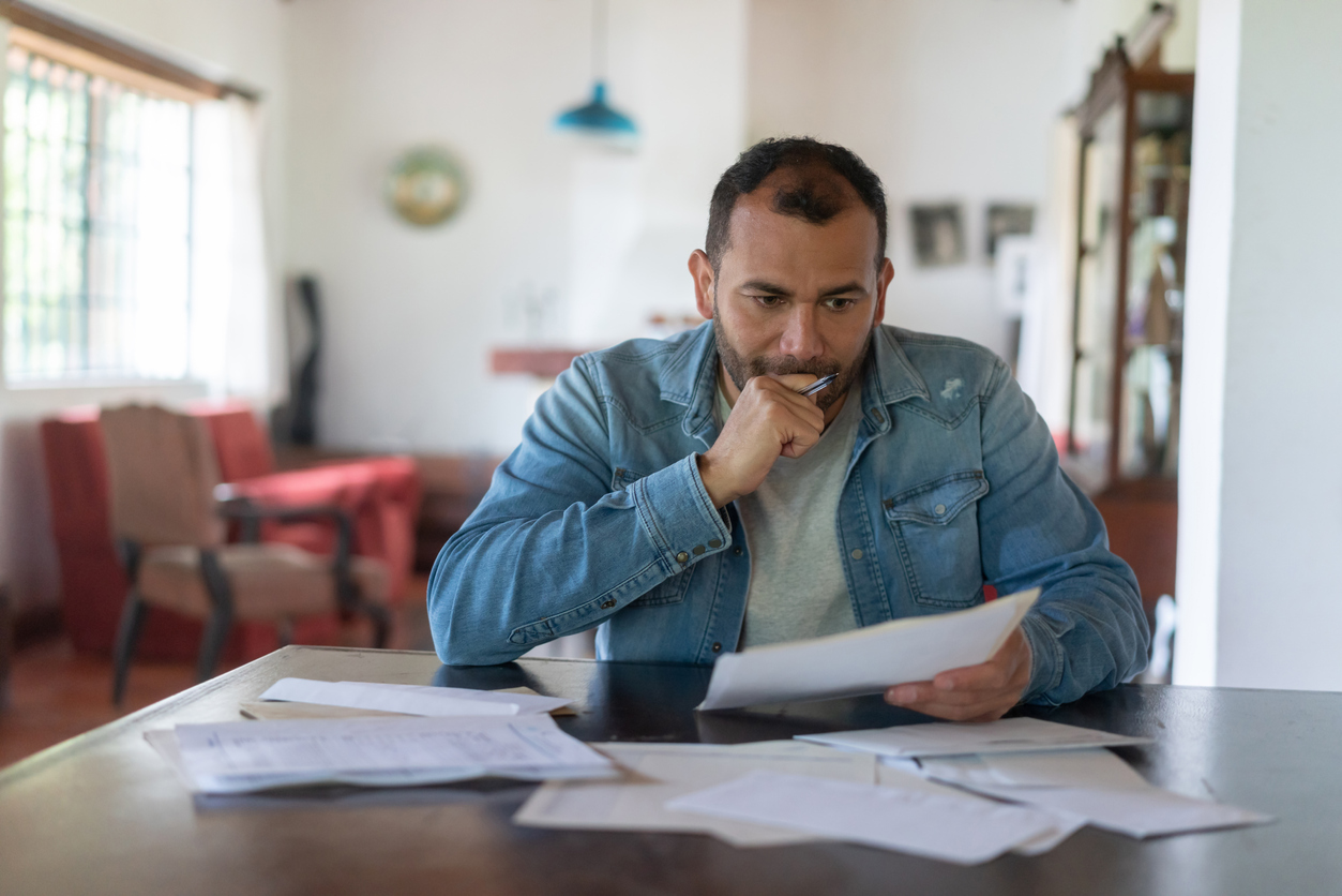 man filing for bankruptcy and looking at finances