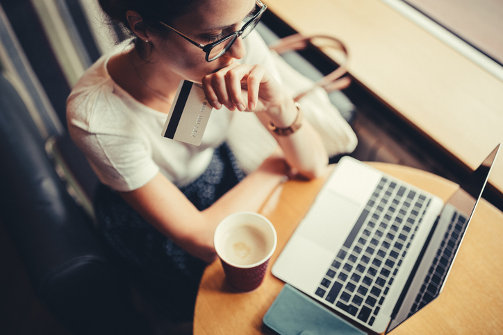 Woman sorting out credit card debt on computer